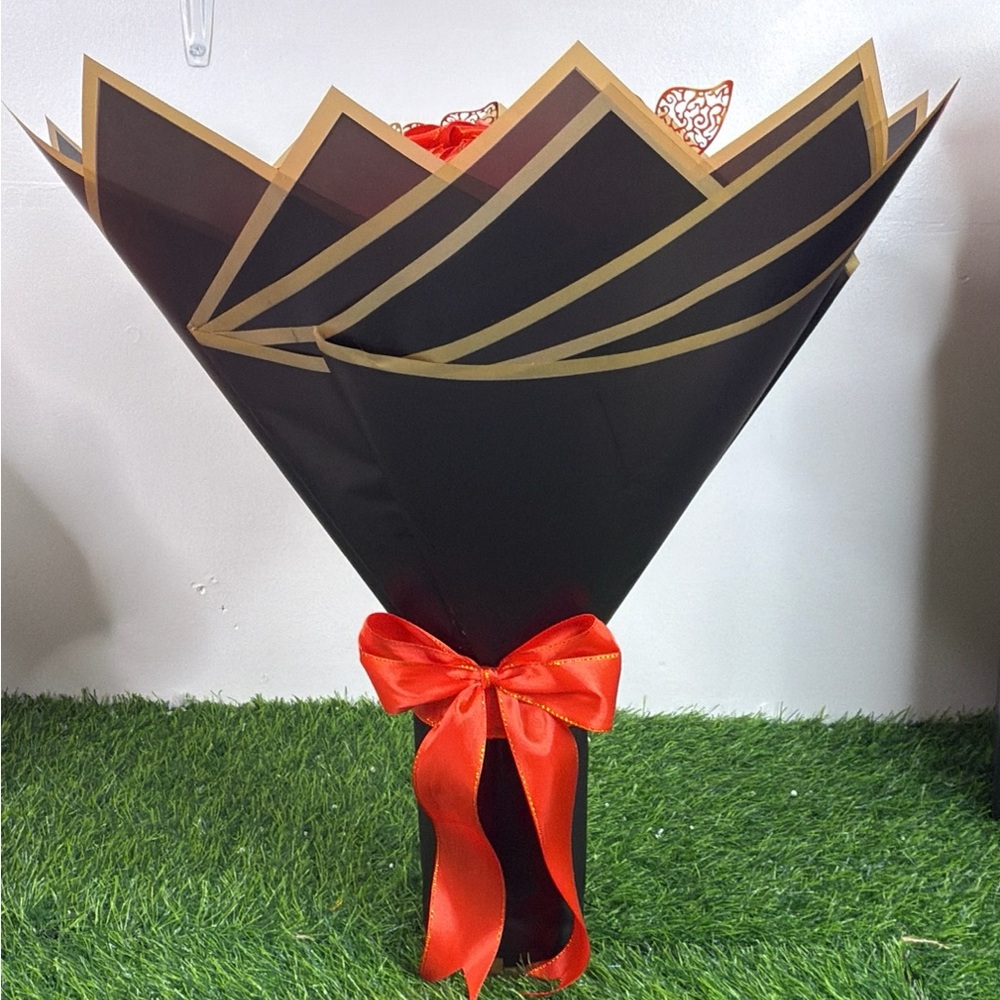 Elegant Black and Gold Bouquet Wrap with Red Bow